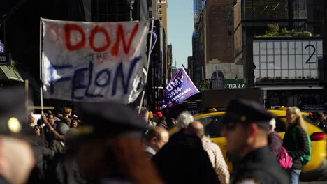 the flag bearing the trump name waves in slow, rhythmic motion under the radiant new york sun, creating a striking visual