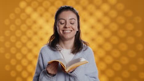 cheerful person liking new novel fresh smell, studio background