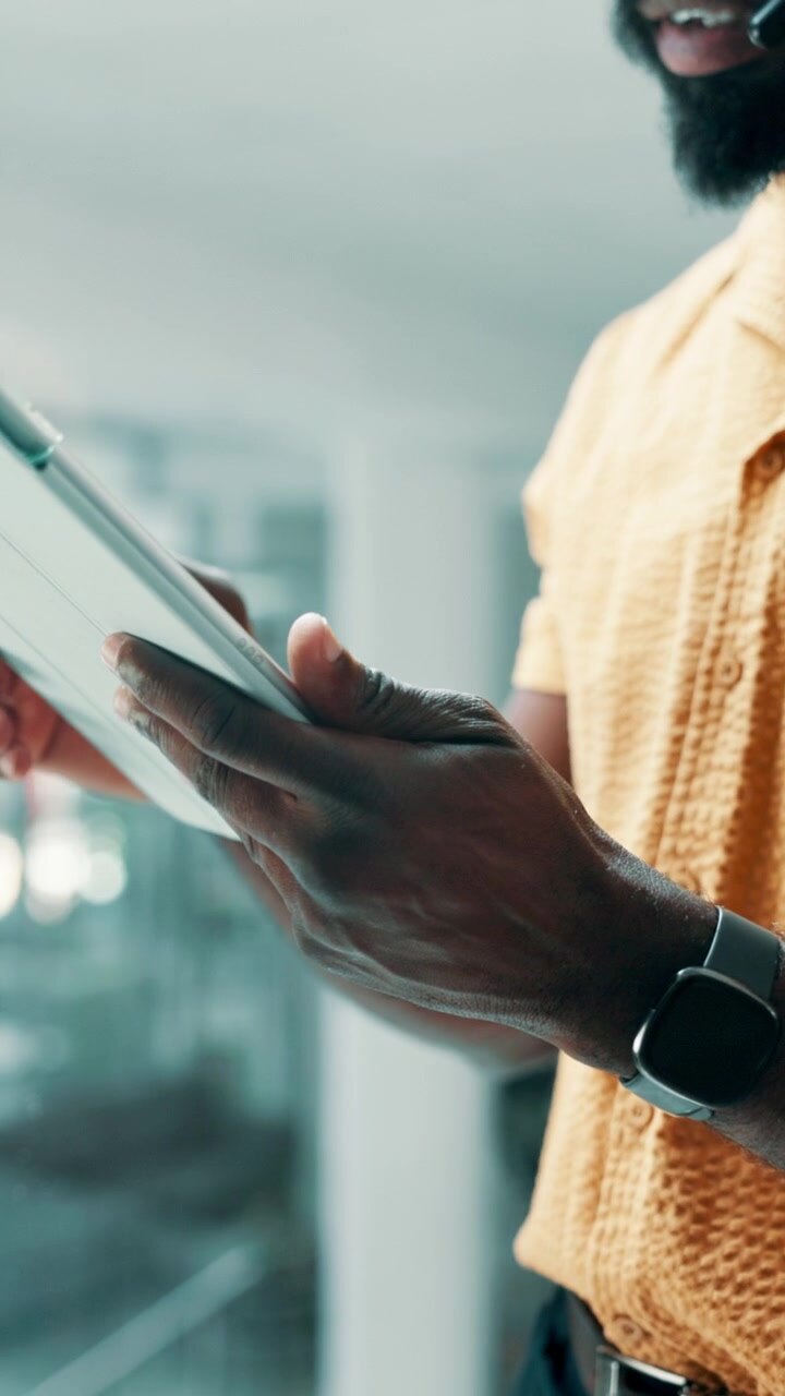 Professional Man Using Digital Tablet in Modern Office