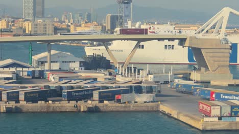 port of barcelona, close-up of ferry ship, approaching with bridge and hotels in the background
