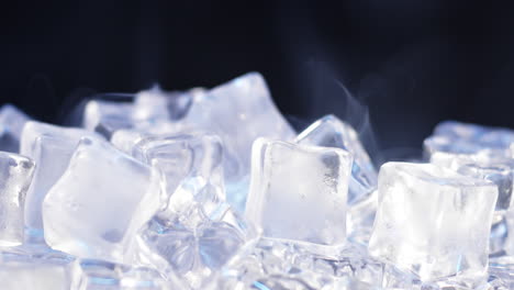 Macro-shot-of-pure-water-ice-cubes-melting-in-slow-motion