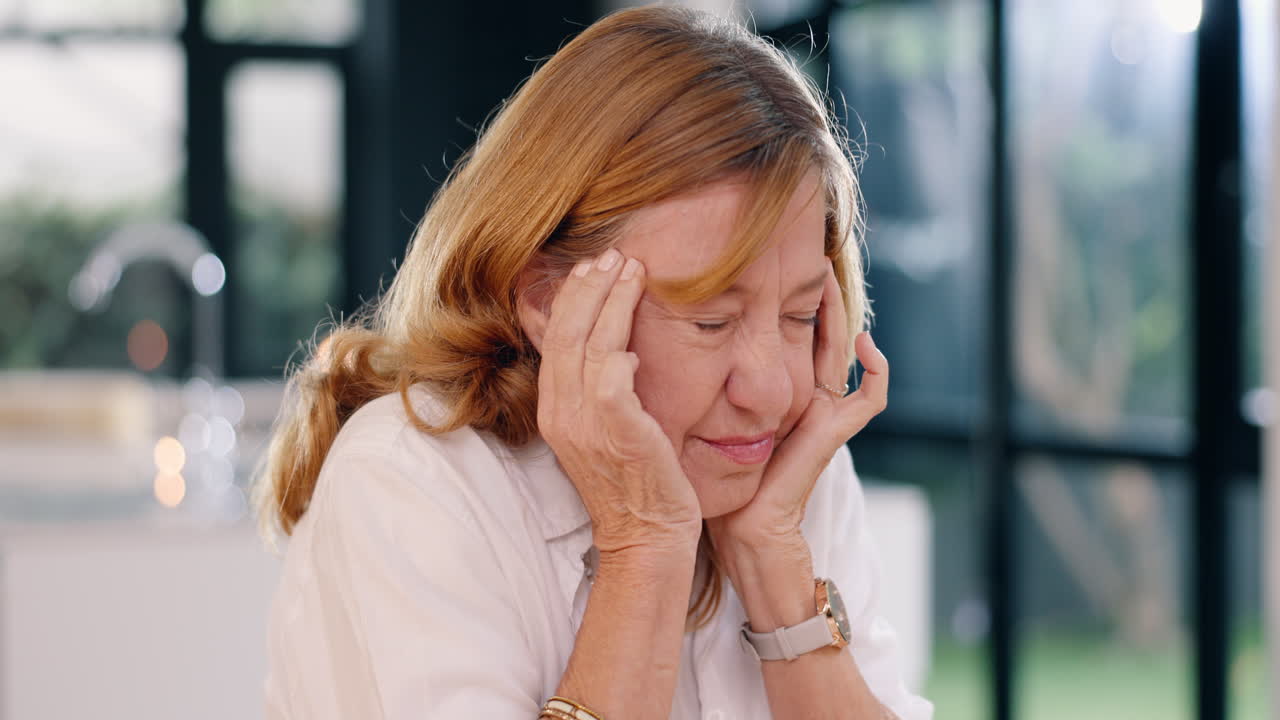 Woman experiencing a headache
