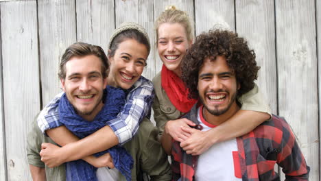 Young-men-giving-piggyback-ride-to-women