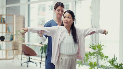 Woman-patient,-dumbbell-and-physiotherapy-of-nurse