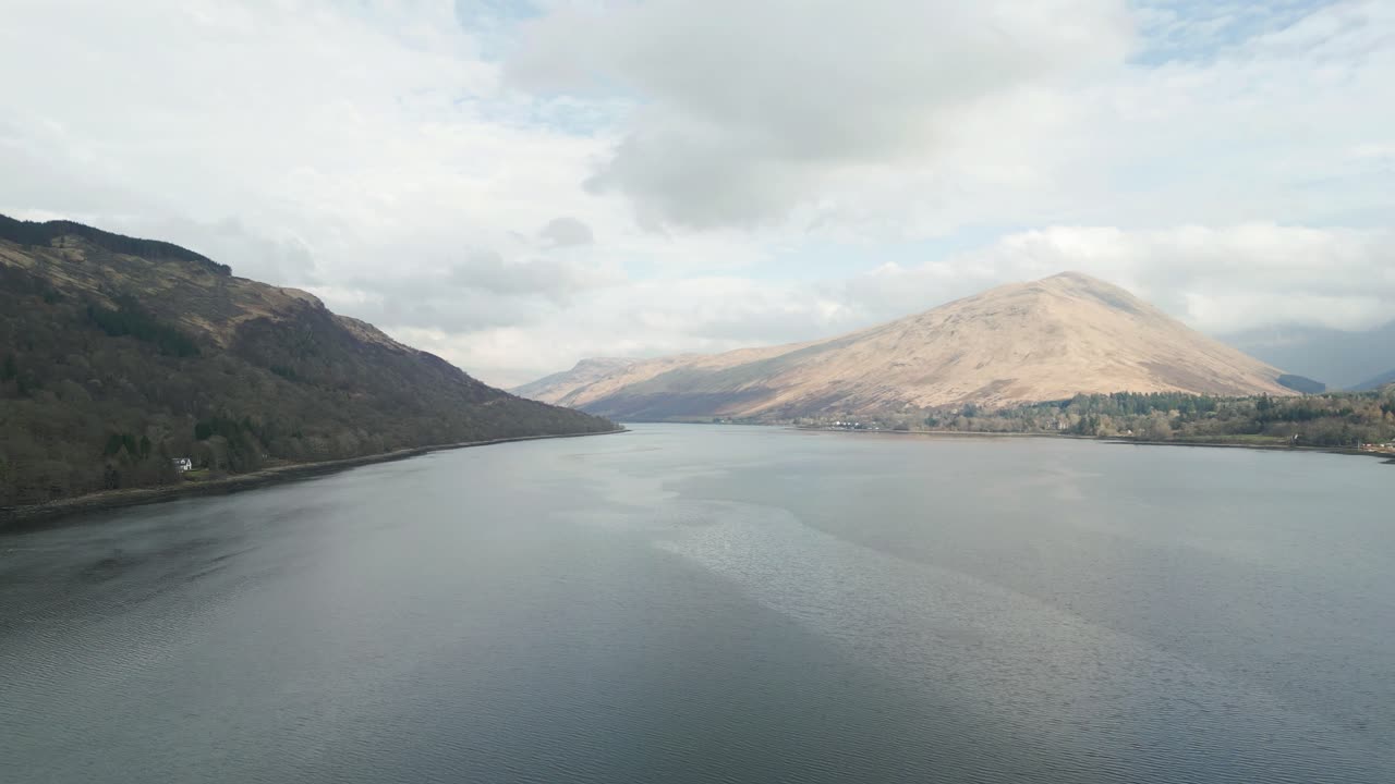 Aerial Fly over Loch With Mountains Surrounding