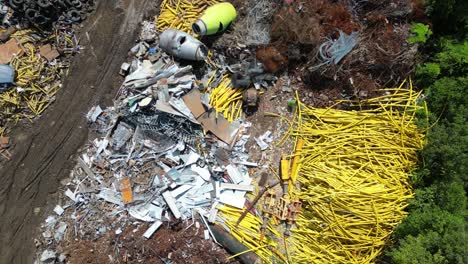 dropping view of scrapyard on a bright sunny day