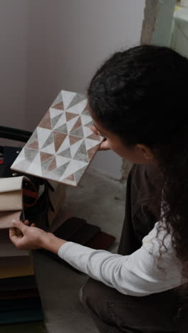 interior designer selecting tiles and fabrics for home renovation