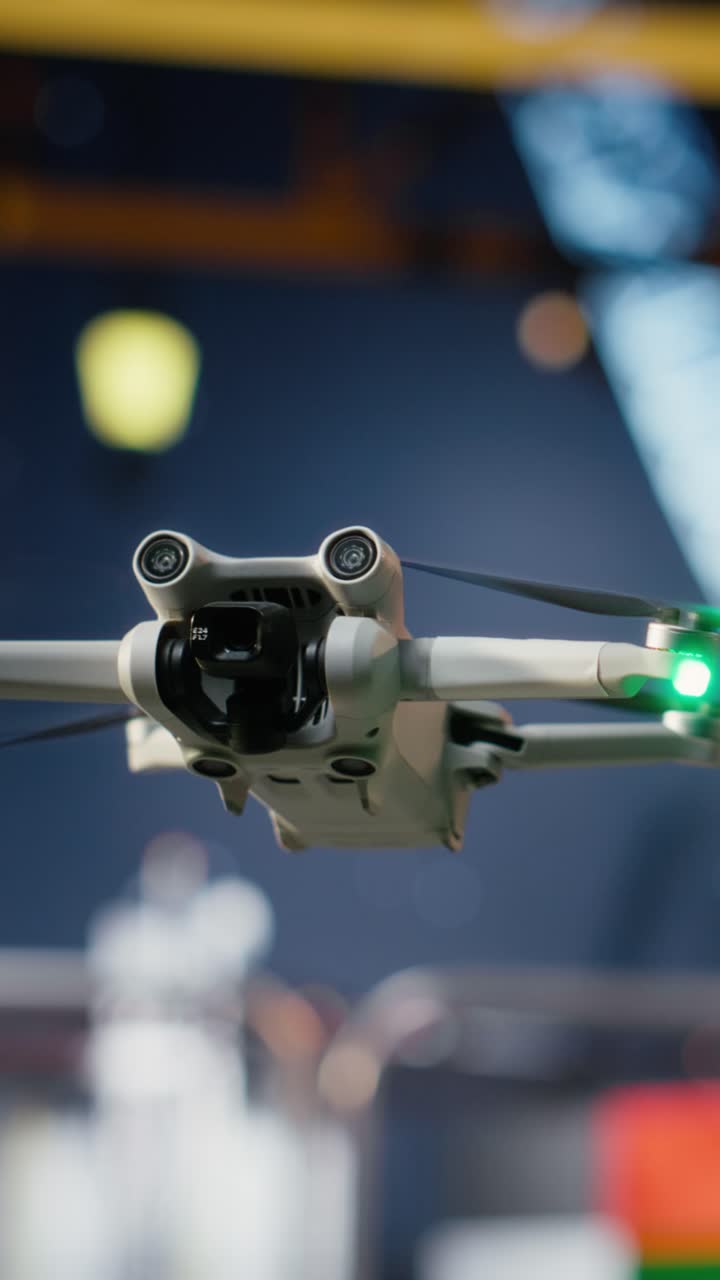 Vertical Video Professional drone operators flies a UAV around a drilling rig