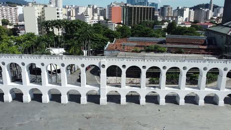 Rio-de-Janeiro-touristic-attraction-Arcos-da-Lapa,-beautiful-architecture-by-drone-aerial