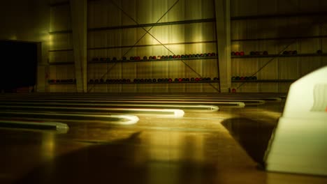 long shadows drift across quiet lanes in empty retro-style bowling environment