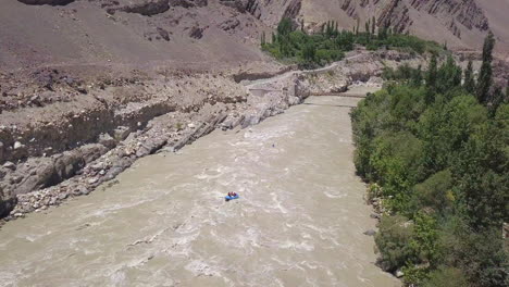 Water-Rafting-In-Zanskar-River-With-Lush-Poplar-Trees-By-The-Ladakh-Range-On-Summer-In-Leh-Ladakh,-India