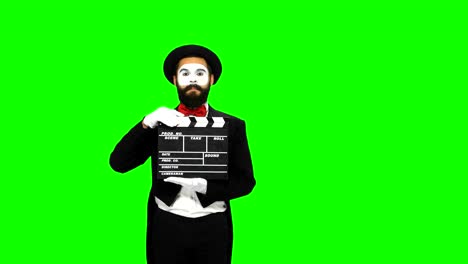 mime with clapperboard on green screen