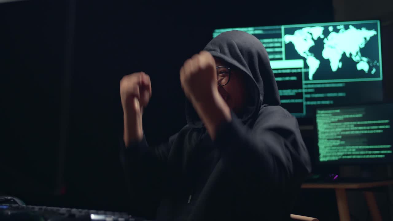 Asian Boy Hacker Using Computer Hacking And Celebrating