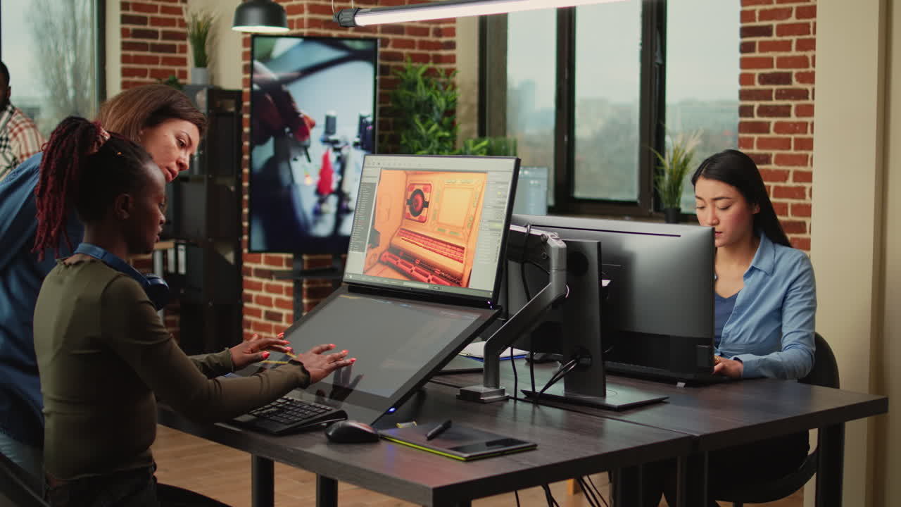 Multiethnic coworkers analyzing graphic developing technology