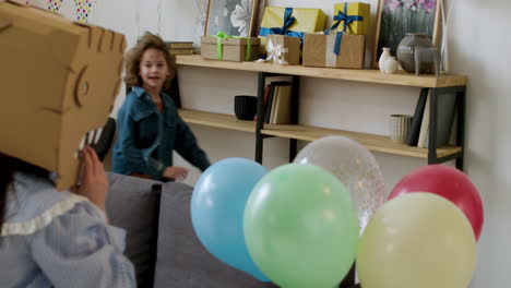 kids playing around the sofa