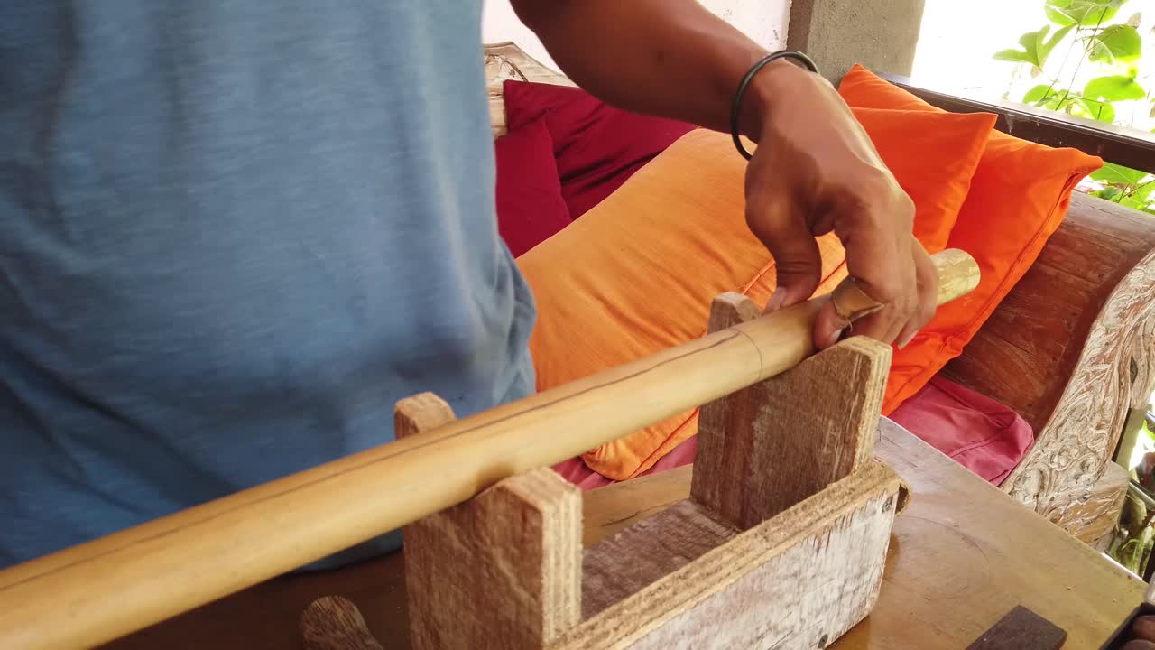 Flute Making Artists Measures Bamboo Musical Instrument of Indonesia Handicraft Traditional Work, Hands Closeup Shot