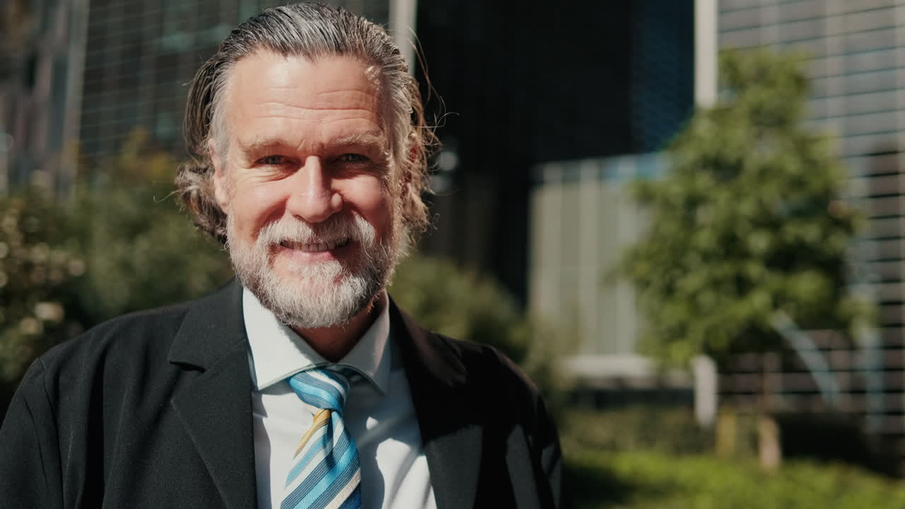 Happy Businessman Smiling at Camera Outdoors