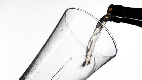 The-process-of-pouring-beer-into-the-glass.-Bright-orange-background.