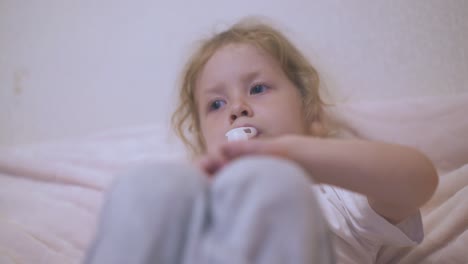 blue eyed girl has procedure with inhaler in soft bed