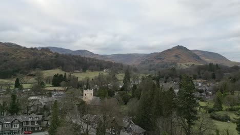 lake district national park cinematic drone aerial video footage of grasmere vlllage, probably cumbria’s most popular tourist village