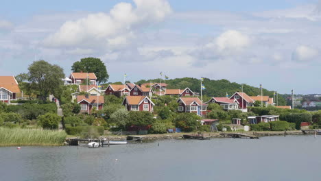 red seaside summer houses during summer at brandaholm, karlskrona, sweden