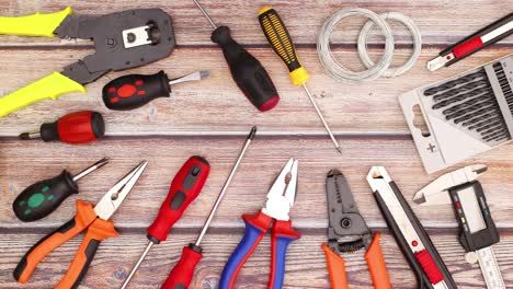 construction and work tools move on by one on work table - stop motion