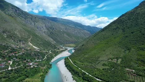 vjosa river aquamarine waters flowing through rocky canyon and colorful spring valley in stunning landscape