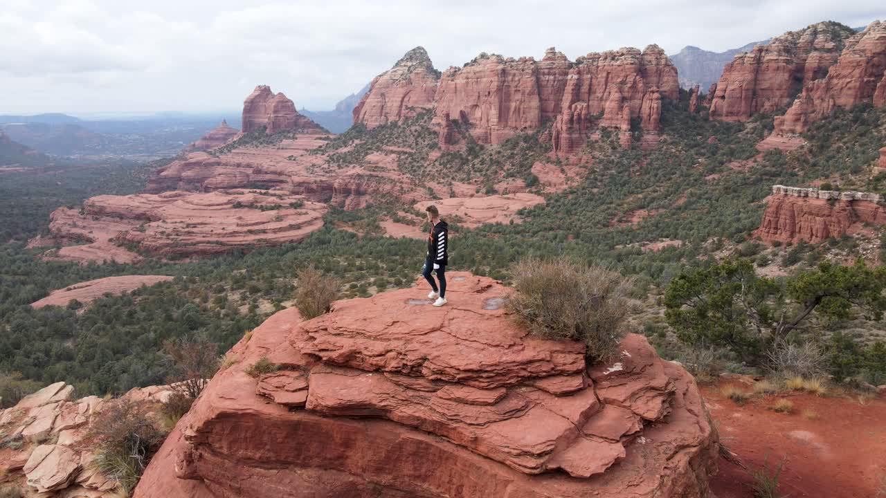 Man on top of mountain peak