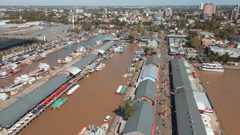 Aerial establishing shot of Puerto de Frutos, a touristic market in Tigre city, Argentina