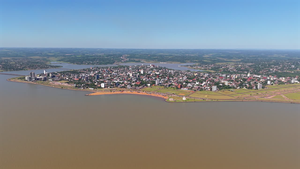 Establishing drone shot of Playa San Jose in Encarnacion in the day in Paraguay
