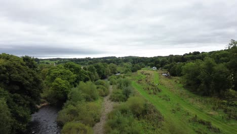 aerial shot flying through arch of newton cap viaduct - bishop auckland, county durham - uk
