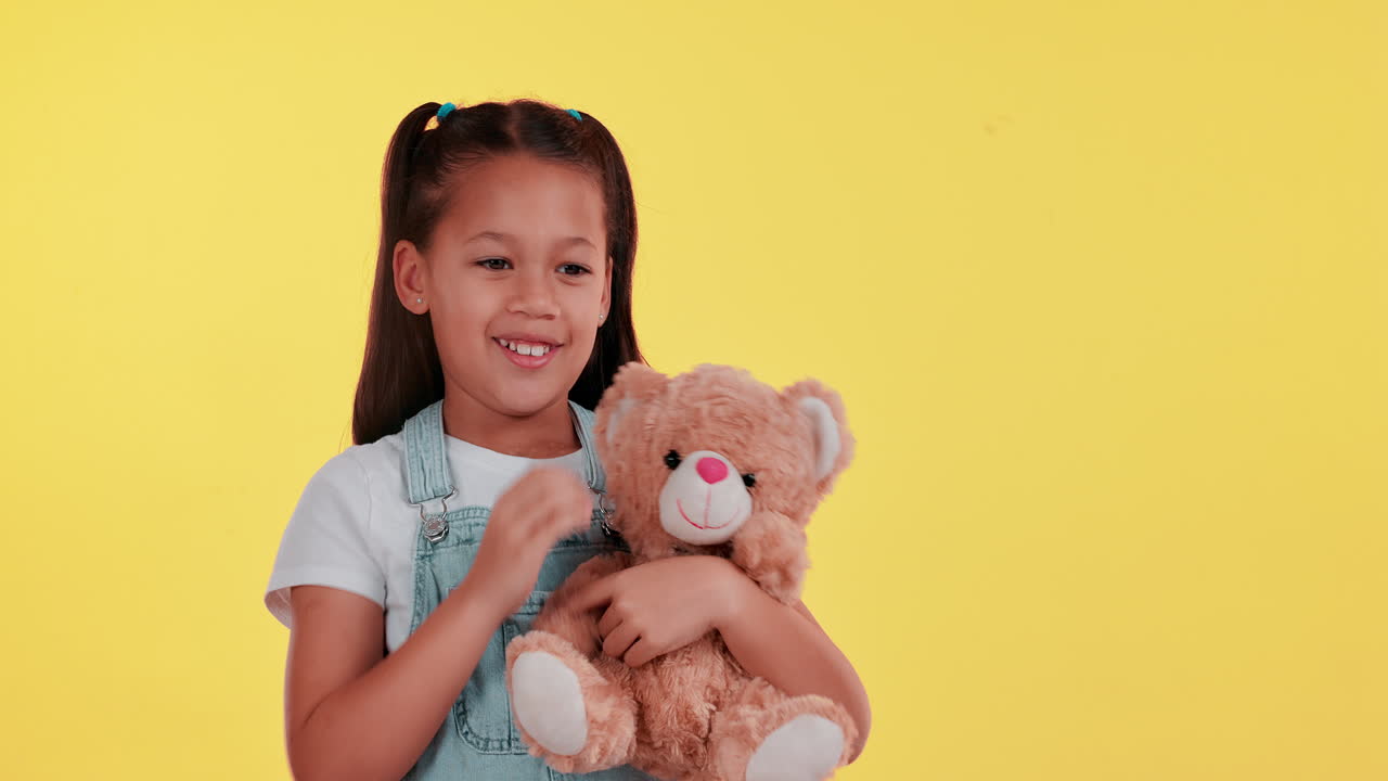 Girl Holding a Teddy Bear