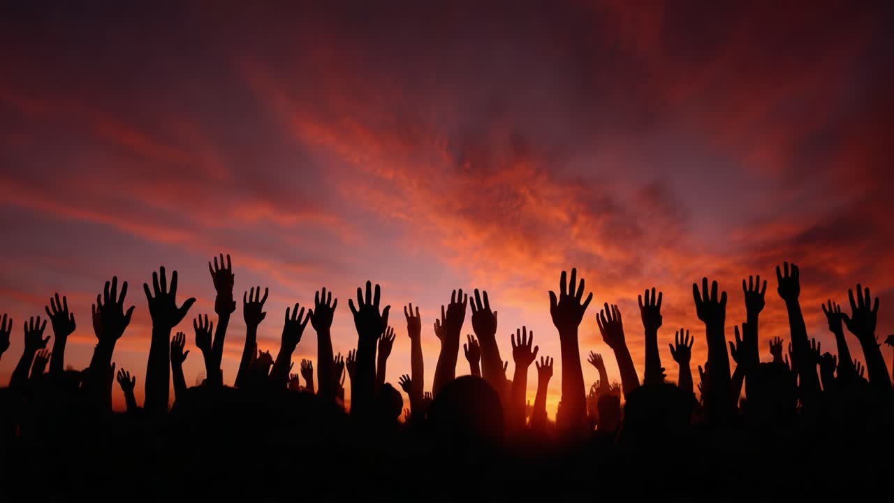 A Stunning Display of Unity and Hope: Silhouetted Hands Reach Upward Against a Vibrant Sunset Sky, Symbolizing Collective Aspiration and Community Spirit