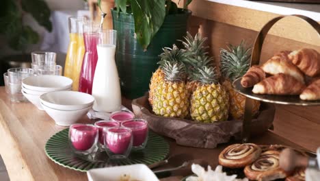 beautiful breakfast buffet with fruit, juices and pastries