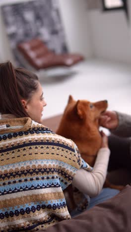 woman and dog cozy up in living room