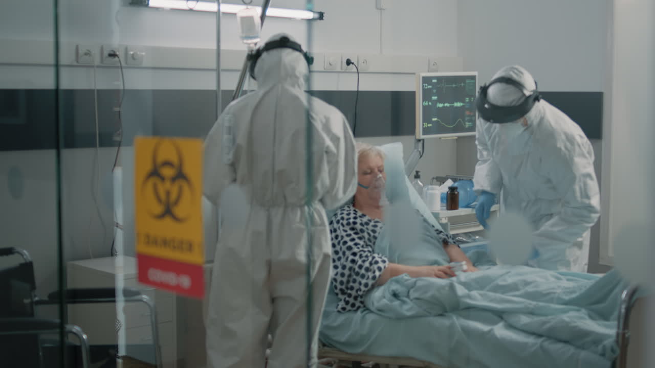 Paramedics wearing protection in lockdown zone at clinic