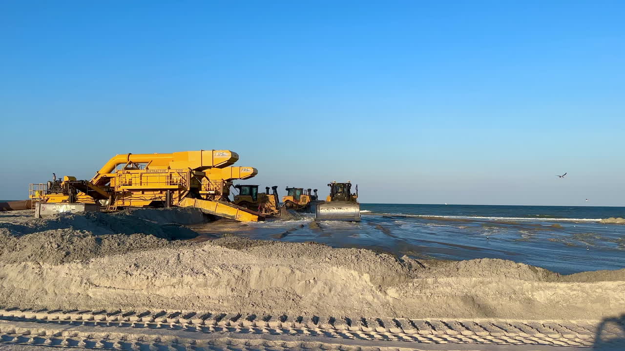 Heavy machinery working on beach nourishment project