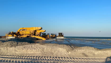 heavy machinery working on beach nourishment project