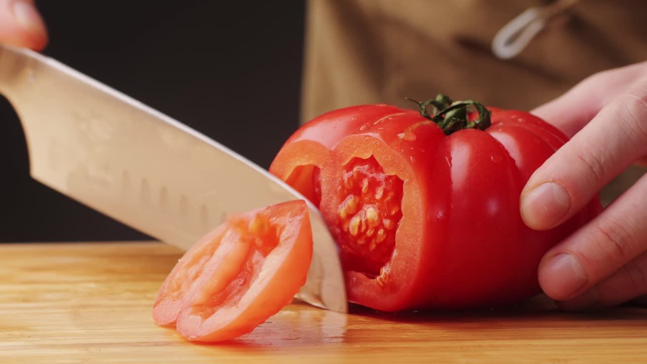 Chop tomato close up, Diced tomatoes on a cutting board for Italian sauce, chef cut tomatoes with knife.