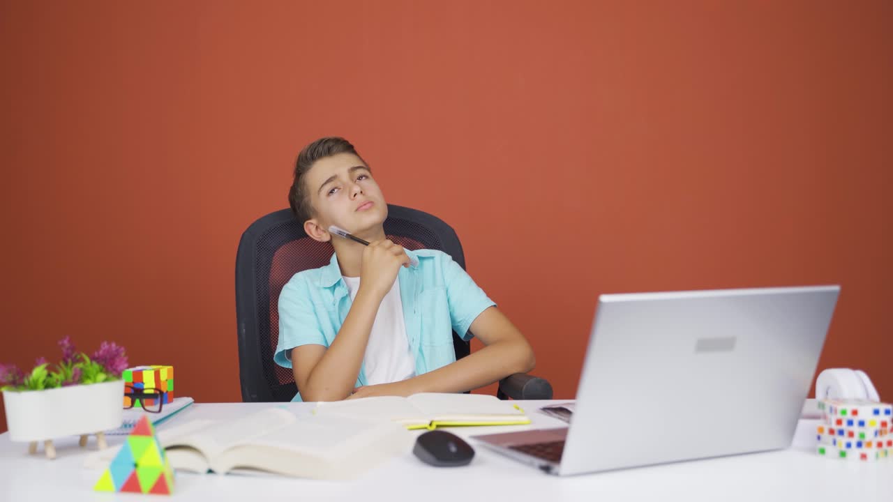 Confused boy thinks and can't figure it out.