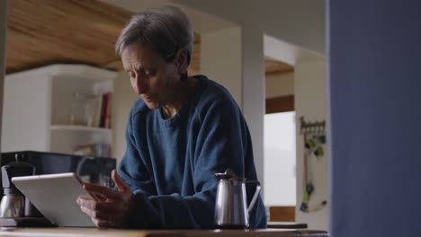 Senior-woman-relaxing-alone-at-home