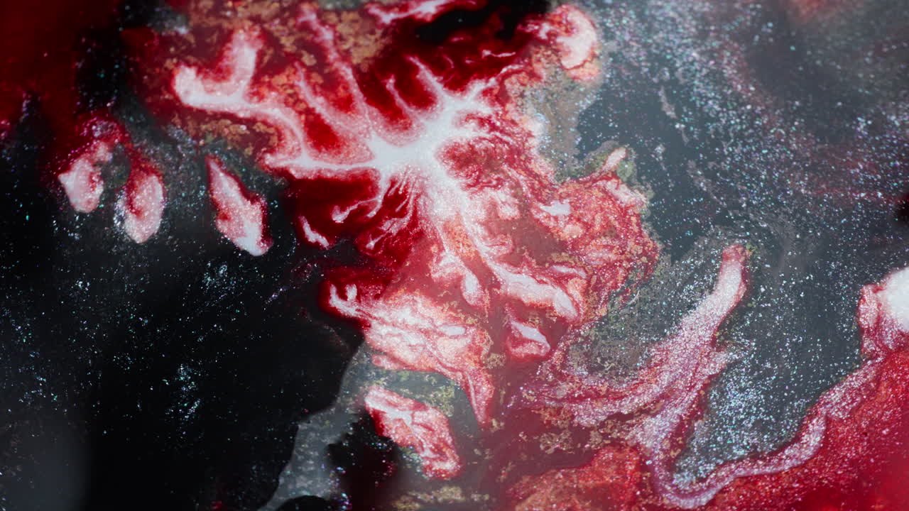 Movement of thick red ink imitating a boiling volcano