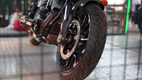 Close-up-view-of-a-motorcycle-wheel-and-parts,-showcasing-its-design