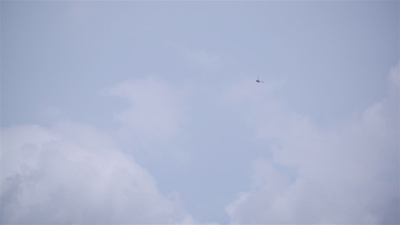 Aerial View of Helicopter Under Blue Sky