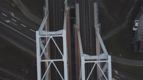 top down slow tracking close up shot of train tracks on a bridge