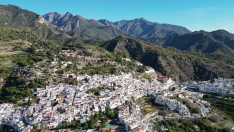 frigiliana white mountain village in malaga, andalusia, spain - aerial 4k backwards