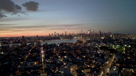 sunset over midtown manhattan, panorama view from brooklyn, golden hour