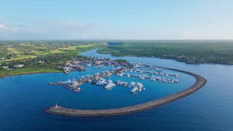 Panoramic-aerial-arc-of-Marina-Casa-de-Campo,-La-Romana,-Caribbean