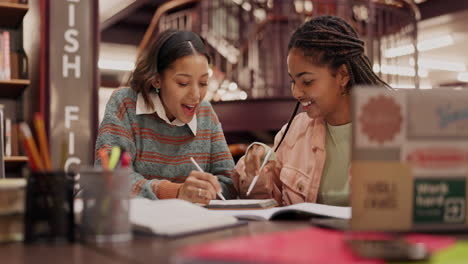 two students studying together in the library