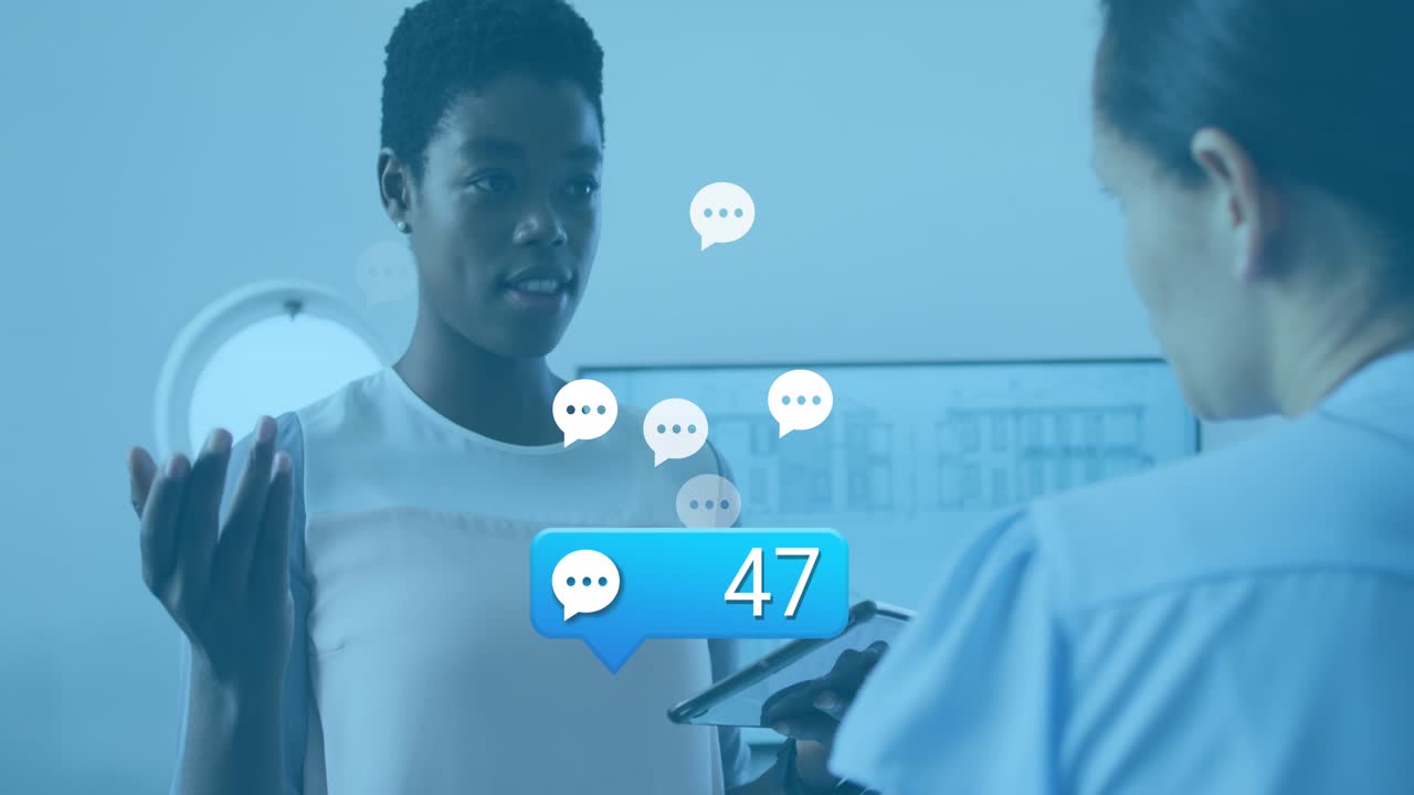 Animation of social media icons with numbers over diverse business people having meeting at office
